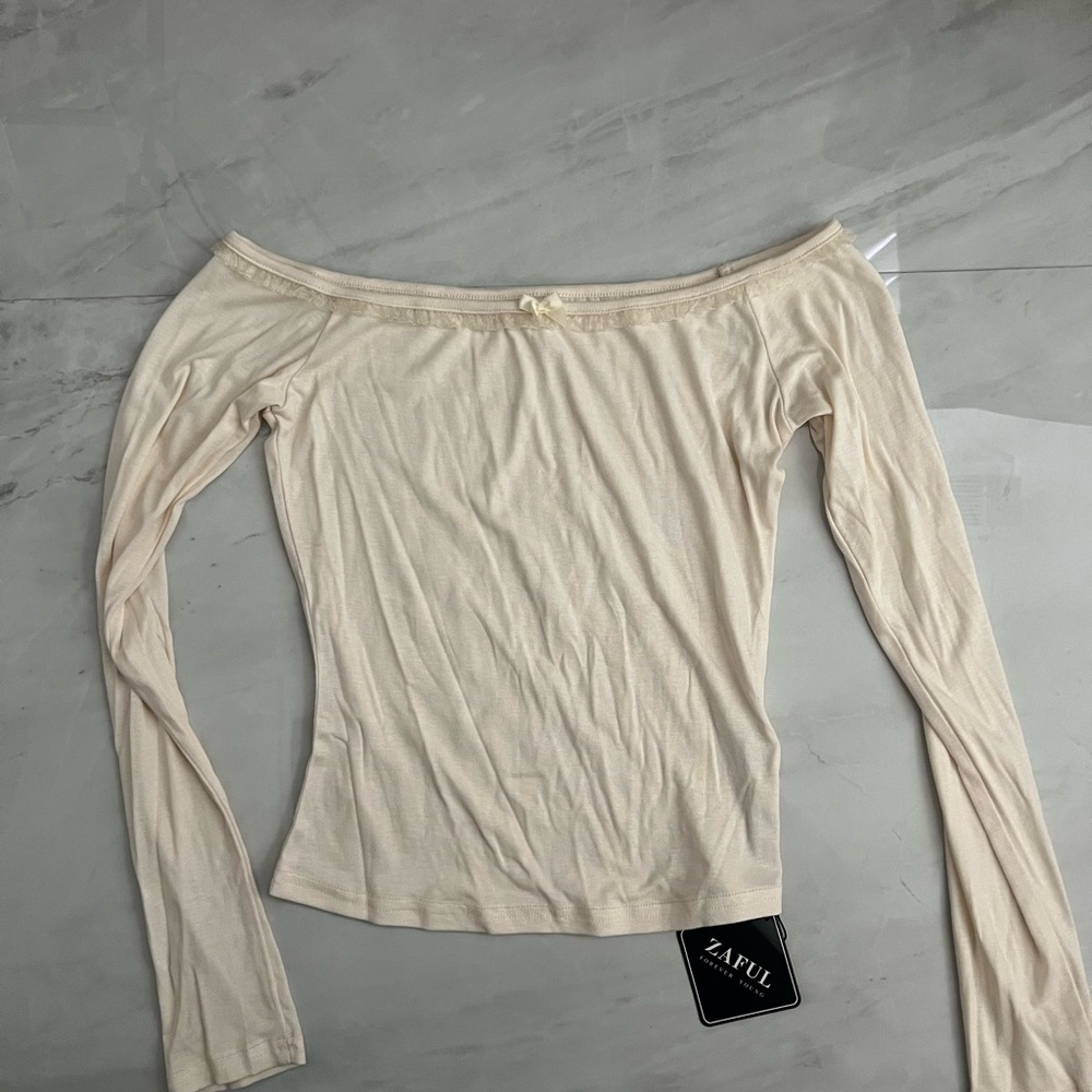 Cream off the shoulder long sleeve top